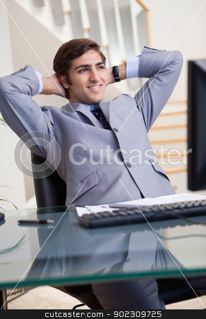 To use this stock image in your creative project, please select the size you need over to the right and click the "Add to Cart" button.
Your downloaded image will come with the Cutcaster watermark removed so don’t worry about the watermark you see on this page. Smiling businessman leaning back in his office stock photo, Smiling young businessman leaning back in his office by Wavebreak Media
