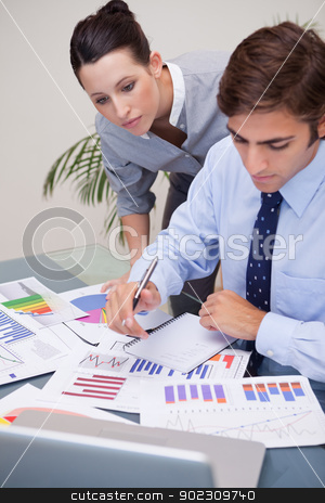 To use this stock image in your creative project, please select the size you need over to the right and click the "Add to Cart" button.
Your downloaded image will come with the Cutcaster watermark removed so don’t worry about the watermark you see on this page. Business team analyzing statistics together stock photo, Young business team analyzing statistics together by Wavebreak Media