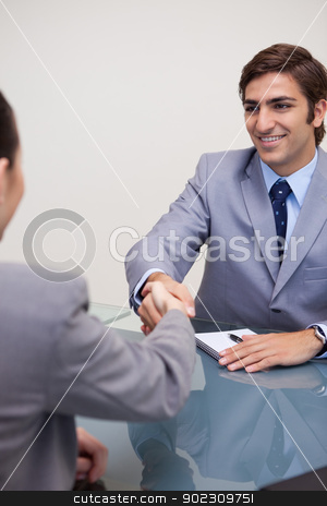 To use this stock image in your creative project, please select the size you need over to the right and click the "Add to Cart" button.
Your downloaded image will come with the Cutcaster watermark removed so don’t worry about the watermark you see on this page. Business partners closing a deal stock photo, Young business partners closing a deal by Wavebreak Media