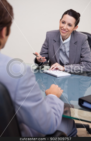 To use this stock image in your creative project, please select the size you need over to the right and click the "Add to Cart" button.
Your downloaded image will come with the Cutcaster watermark removed so don’t worry about the watermark you see on this page. Smiling businesswoman with notepad in negotiation stock photo, Smiling young businesswoman with notepad in negotiation by Wavebreak Media