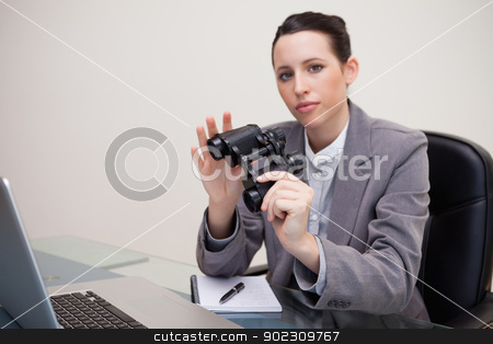 To use this stock image in your creative project, please select the size you need over to the right and click the "Add to Cart" button.
Your downloaded image will come with the Cutcaster watermark removed so don’t worry about the watermark you see on this page. Businesswoman on her desk with binoculars stock photo, Young businesswoman on her desk with binoculars by Wavebreak Media