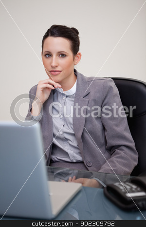 To use this stock image in your creative project, please select the size you need over to the right and click the "Add to Cart" button.
Your downloaded image will come with the Cutcaster watermark removed so don’t worry about the watermark you see on this page. Businesswoman sitting in her office stock photo, Young businesswoman sitting in her office by Wavebreak Media