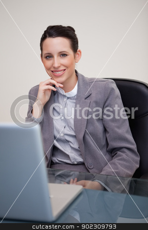To use this stock image in your creative project, please select the size you need over to the right and click the "Add to Cart" button.
Your downloaded image will come with the Cutcaster watermark removed so don’t worry about the watermark you see on this page. Smiling businesswoman sitting in her office stock photo, Smiling young businesswoman sitting in her office by Wavebreak Media