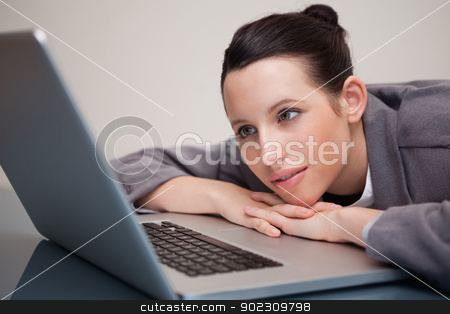 To use this stock image in your creative project, please select the size you need over to the right and click the "Add to Cart" button.
Your downloaded image will come with the Cutcaster watermark removed so don’t worry about the watermark you see on this page. Businesswoman leaning against her laptop stock photo, Young businesswoman leaning against her laptop by Wavebreak Media