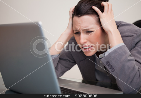 To use this stock image in your creative project, please select the size you need over to the right and click the "Add to Cart" button.
Your downloaded image will come with the Cutcaster watermark removed so don’t worry about the watermark you see on this page. Businesswoman experiencing trouble with her notebook stock photo, Young businesswoman experiencing trouble with her notebook by Wavebreak Media