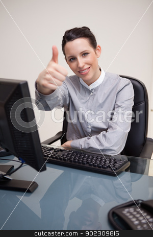 To use this stock image in your creative project, please select the size you need over to the right and click the "Add to Cart" button.
Your downloaded image will come with the Cutcaster watermark removed so don’t worry about the watermark you see on this page. Smiling businesswoman giving thumb up stock photo, Smiling young businesswoman giving thumb up by Wavebreak Media