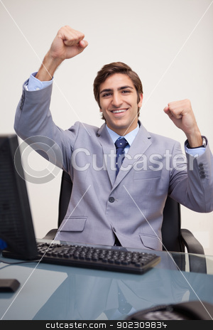 To use this stock image in your creative project, please select the size you need over to the right and click the "Add to Cart" button.
Your downloaded image will come with the Cutcaster watermark removed so don’t worry about the watermark you see on this page. Businessman raising his fists in success stock photo, Young businessman raising his fists in success by Wavebreak Media