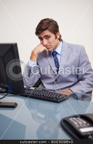 To use this stock image in your creative project, please select the size you need over to the right and click the "Add to Cart" button.
Your downloaded image will come with the Cutcaster watermark removed so don’t worry about the watermark you see on this page. Businessman sitting bored at his workplace stock photo, Young businessman sitting bored at his workplace by Wavebreak Media