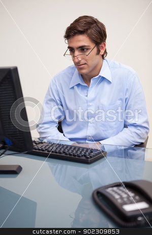 To use this stock image in your creative project, please select the size you need over to the right and click the "Add to Cart" button.
Your downloaded image will come with the Cutcaster watermark removed so don’t worry about the watermark you see on this page. Businessman reading an e-mail stock photo, Young businessman reading an e-mail by Wavebreak Media
