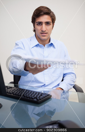 To use this stock image in your creative project, please select the size you need over to the right and click the "Add to Cart" button.
Your downloaded image will come with the Cutcaster watermark removed so don’t worry about the watermark you see on this page. Businessman handing over paperwork stock photo, Young businessman handing over paperwork by Wavebreak Media