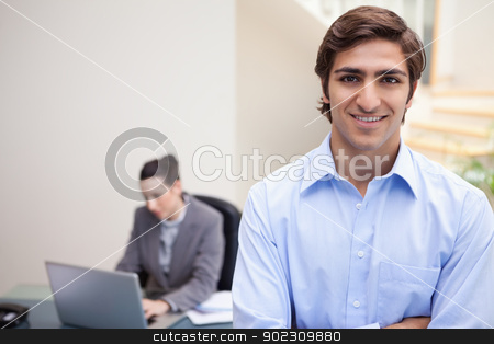To use this stock image in your creative project, please select the size you need over to the right and click the "Add to Cart" button.
Your downloaded image will come with the Cutcaster watermark removed so don’t worry about the watermark you see on this page. Smiling businessman with colleague on her laptop behind him stock photo, Smiling young businessman with colleague on her laptop behind him by Wavebreak Media