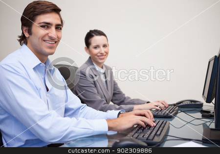 To use this stock image in your creative project, please select the size you need over to the right and click the "Add to Cart" button.
Your downloaded image will come with the Cutcaster watermark removed so don’t worry about the watermark you see on this page. Side view of smiling colleagues working next to each other stock photo, Side view of smiling young colleagues working next to each other by Wavebreak Media