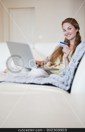 To use this stock image in your creative project, please select the size you need over to the right and click the "Add to Cart" button.
Your downloaded image will come with the Cutcaster watermark removed so don’t worry about the watermark you see on this page. Woman on the sofa booking a flight online stock photo, Young woman on the sofa booking a flight online by Wavebreak Media