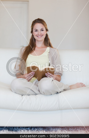 To use this stock image in your creative project, please select the size you need over to the right and click the "Add to Cart" button.
Your downloaded image will come with the Cutcaster watermark removed so don’t worry about the watermark you see on this page. Woman enjoys reading a book on her couch stock photo, Young woman enjoys reading a a book on her couch by Wavebreak Media