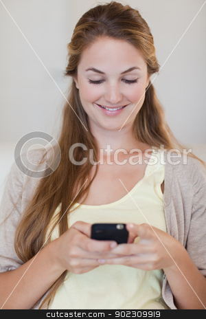 To use this stock image in your creative project, please select the size you need over to the right and click the "Add to Cart" button.
Your downloaded image will come with the Cutcaster watermark removed so don’t worry about the watermark you see on this page. Woman typing a text message stock photo, Young woman typing a text message by Wavebreak Media