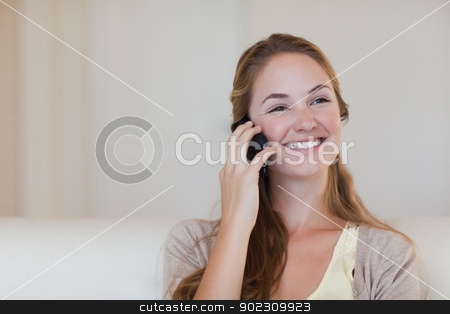 To use this stock image in your creative project, please select the size you need over to the right and click the "Add to Cart" button.
Your downloaded image will come with the Cutcaster watermark removed so don’t worry about the watermark you see on this page. Woman enjoying her telephone conversation stock photo, Young woman enjoying her telephone conversation by Wavebreak Media