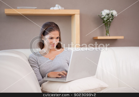 To use this stock image in your creative project, please select the size you need over to the right and click the "Add to Cart" button.
Your downloaded image will come with the Cutcaster watermark removed so don’t worry about the watermark you see on this page. Woman with notebook on her sofa stock photo, Young woman with notebook on her sofa by Wavebreak Media