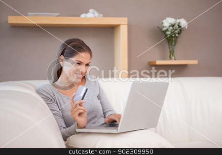 To use this stock image in your creative project, please select the size you need over to the right and click the "Add to Cart" button.
Your downloaded image will come with the Cutcaster watermark removed so don’t worry about the watermark you see on this page. Woman on the sofa hunting bargain online stock photo, Young woman on the sofa hunting bargain online by Wavebreak Media