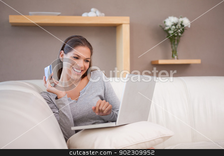 To use this stock image in your creative project, please select the size you need over to the right and click the "Add to Cart" button.
Your downloaded image will come with the Cutcaster watermark removed so don’t worry about the watermark you see on this page. Woman shopping online on her sofa stock photo, Young woman shopping online on her sofa by Wavebreak Media