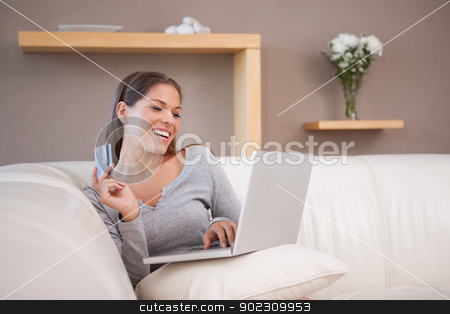 To use this stock image in your creative project, please select the size you need over to the right and click the "Add to Cart" button.
Your downloaded image will come with the Cutcaster watermark removed so don’t worry about the watermark you see on this page. Smiling woman shopping online on the sofa stock photo, Smiling young woman shopping online on the sofa by Wavebreak Media