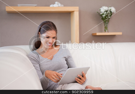 To use this stock image in your creative project, please select the size you need over to the right and click the "Add to Cart" button.
Your downloaded image will come with the Cutcaster watermark removed so don’t worry about the watermark you see on this page. Woman with tablet pc on the sofa stock photo, Young woman with tablet pc on the sofa by Wavebreak Media