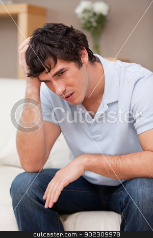 To use this stock image in your creative project, please select the size you need over to the right and click the "Add to Cart" button.
Your downloaded image will come with the Cutcaster watermark removed so don’t worry about the watermark you see on this page. Despaired man sitting on the sofa stock photo, Despaired young man sitting on the sofa by Wavebreak Media