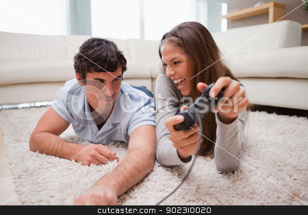 To use this stock image in your creative project, please select the size you need over to the right and click the "Add to Cart" button.
Your downloaded image will come with the Cutcaster watermark removed so don’t worry about the watermark you see on this page. Woman just defeated her boyfriend at a video game stock photo, Young woman just defeated her boyfriend at a video game by Wavebreak Media