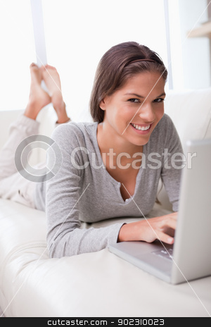 To use this stock image in your creative project, please select the size you need over to the right and click the "Add to Cart" button.
Your downloaded image will come with the Cutcaster watermark removed so don’t worry about the watermark you see on this page. Smiling woman lying with notebook on the sofa stock photo, Smiling young woman lying with notebook on the sofa by Wavebreak Media