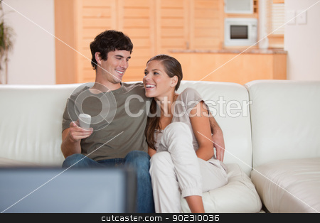 To use this stock image in your creative project, please select the size you need over to the right and click the "Add to Cart" button.
Your downloaded image will come with the Cutcaster watermark removed so don’t worry about the watermark you see on this page. Laughing couple watching funny movie together stock photo, Laughing young couple watching funny movie together by Wavebreak Media
