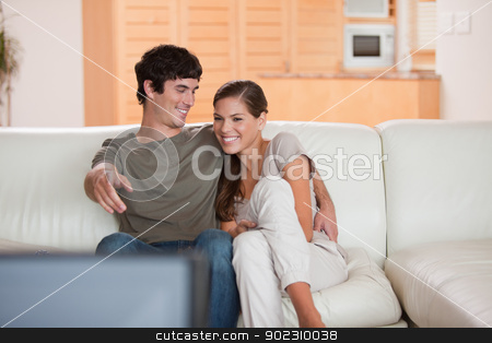 To use this stock image in your creative project, please select the size you need over to the right and click the "Add to Cart" button.
Your downloaded image will come with the Cutcaster watermark removed so don’t worry about the watermark you see on this page. Couple on the sofa enjoying a movie together stock photo, Young couple on the sofa enjoying a movie together by Wavebreak Media