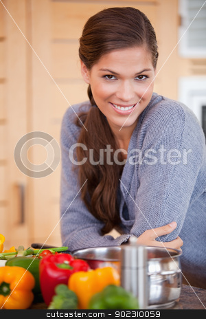 To use this stock image in your creative project, please select the size you need over to the right and click the "Add to Cart" button.
Your downloaded image will come with the Cutcaster watermark removed so don’t worry about the watermark you see on this page. Smiling woman leaning against the kitchen counter stock photo, Smiling young woman leaning against the kitchen counter by Wavebreak Media