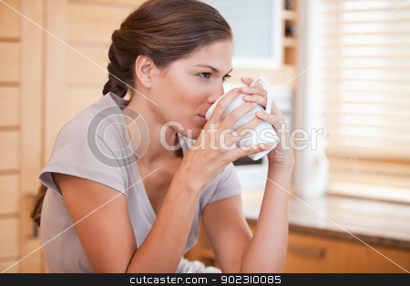 To use this stock image in your creative project, please select the size you need over to the right and click the "Add to Cart" button.
Your downloaded image will come with the Cutcaster watermark removed so don’t worry about the watermark you see on this page. Side view of woman drinking coffee stock photo, Side view of young woman drinking coffee by Wavebreak Media