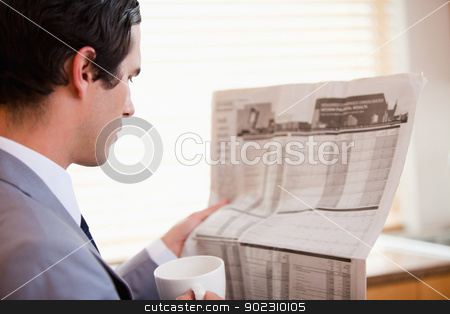 To use this stock image in your creative project, please select the size you need over to the right and click the "Add to Cart" button.
Your downloaded image will come with the Cutcaster watermark removed so don’t worry about the watermark you see on this page. Side view of businessman reading newspaper stock photo, Side view of young businessman reading newspaper by Wavebreak Media