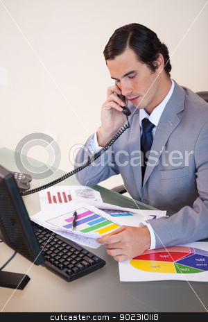 To use this stock image in your creative project, please select the size you need over to the right and click the "Add to Cart" button.
Your downloaded image will come with the Cutcaster watermark removed so don’t worry about the watermark you see on this page. Businessman on the phone talking about statistics stock photo, Young businessman on the phone talking about statistics by Wavebreak Media
