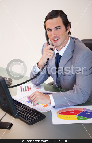 To use this stock image in your creative project, please select the size you need over to the right and click the "Add to Cart" button.
Your downloaded image will come with the Cutcaster watermark removed so don’t worry about the watermark you see on this page. Smiling businessman on the phone working on statistics stock photo, Smiling young businessman on the phone working on statistics by Wavebreak Media