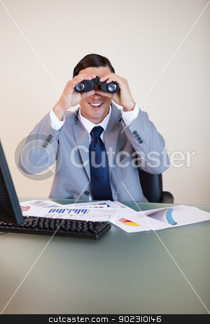 To use this stock image in your creative project, please select the size you need over to the right and click the "Add to Cart" button.
Your downloaded image will come with the Cutcaster watermark removed so don’t worry about the watermark you see on this page. Businessman at his desk looking through binoculars stock photo, Smiling businessman at his desk looking through binoculars by Wavebreak Media