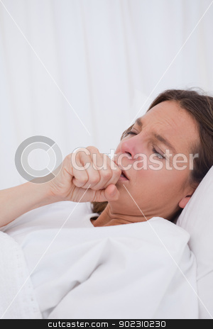 To use this stock image in your creative project, please select the size you need over to the right and click the "Add to Cart" button.
Your downloaded image will come with the Cutcaster watermark removed so don’t worry about the watermark you see on this page. Woman in bed couching stock photo, Woman lying in bed while couching by Wavebreak Media