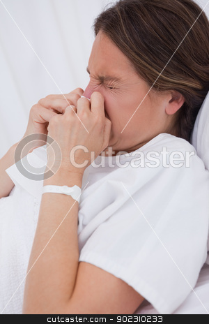 To use this stock image in your creative project, please select the size you need over to the right and click the "Add to Cart" button.
Your downloaded image will come with the Cutcaster watermark removed so don’t worry about the watermark you see on this page. Side view of women in bed sneezing stock photo, Side view of woman in hospital bed sneezing by Wavebreak Media