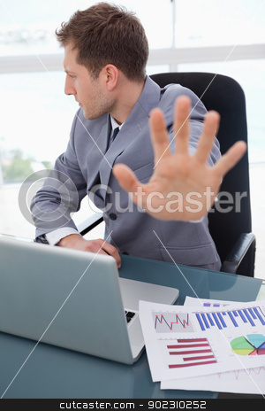 To use this stock image in your creative project, please select the size you need over to the right and click the "Add to Cart" button.
Your downloaded image will come with the Cutcaster watermark removed so don’t worry about the watermark you see on this page. Businessman does not want to listen stock photo, Businessman at his desk does not want to listen by Wavebreak Media