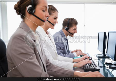 To use this stock image in your creative project, please select the size you need over to the right and click the "Add to Cart" button.
Your downloaded image will come with the Cutcaster watermark removed so don’t worry about the watermark you see on this page. Side view of customer service employees stock photo, Side view of customer service employees at work by Wavebreak Media