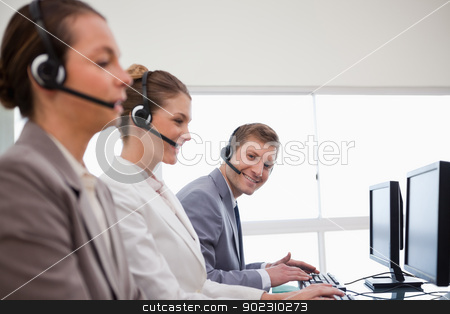 To use this stock image in your creative project, please select the size you need over to the right and click the "Add to Cart" button.
Your downloaded image will come with the Cutcaster watermark removed so don’t worry about the watermark you see on this page. Side view of call center team stock photo, Side view of call center team at work by Wavebreak Media