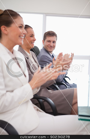 To use this stock image in your creative project, please select the size you need over to the right and click the "Add to Cart" button.
Your downloaded image will come with the Cutcaster watermark removed so don’t worry about the watermark you see on this page. Side view of business team applauding stock photo, Side view of business team applauding after a presentation by Wavebreak Media