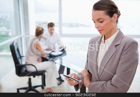 To use this stock image in your creative project, please select the size you need over to the right and click the "Add to Cart" button.
Your downloaded image will come with the Cutcaster watermark removed so don’t worry about the watermark you see on this page. Standing real estate agent with cellphone stock photo, Standing real estate agent with cellphone and sitting clients behind her by Wavebreak Media