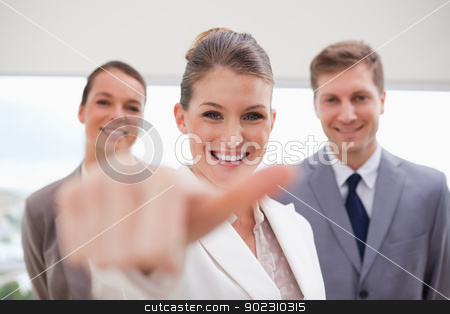 To use this stock image in your creative project, please select the size you need over to the right and click the "Add to Cart" button.
Your downloaded image will come with the Cutcaster watermark removed so don’t worry about the watermark you see on this page. HR Manager about to give thumb up stock photo, HR Manager with team behind her about to give thumb up by Wavebreak Media