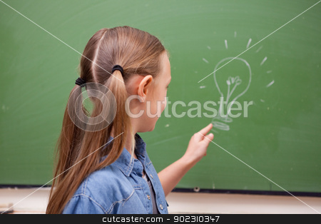 To use this stock image in your creative project, please select the size you need over to the right and click the "Add to Cart" button.
Your downloaded image will come with the Cutcaster watermark removed so don’t worry about the watermark you see on this page. Schoolgirl pointing at a bulb stock photo, Schoolgirl pointing at a bulb on a blackboard by Wavebreak Media