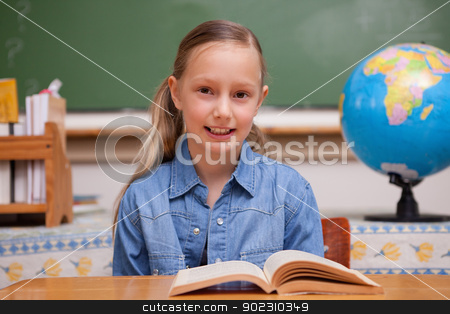 To use this stock image in your creative project, please select the size you need over to the right and click the "Add to Cart" button.
Your downloaded image will come with the Cutcaster watermark removed so don’t worry about the watermark you see on this page. Schoolgirl reading a book stock photo, Schoolgirl reading a book in a classroom by Wavebreak Media