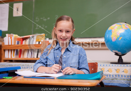To use this stock image in your creative project, please select the size you need over to the right and click the "Add to Cart" button.
Your downloaded image will come with the Cutcaster watermark removed so don’t worry about the watermark you see on this page. Cute schoolgirl doing classwork stock photo, Cute schoolgirl doing classwork while looking at the camera by Wavebreak Media