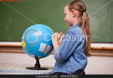 To use this stock image in your creative project, please select the size you need over to the right and click the "Add to Cart" button.
Your downloaded image will come with the Cutcaster watermark removed so don’t worry about the watermark you see on this page. Schoolgirl looking at a globe stock photo, Schoolgirl looking at a globe in a classroom by Wavebreak Media