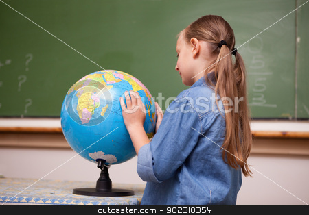 To use this stock image in your creative project, please select the size you need over to the right and click the "Add to Cart" button.
Your downloaded image will come with the Cutcaster watermark removed so don’t worry about the watermark you see on this page. Focused schoolgirl looking at a globe stock photo, Focused schoolgirl looking at a globe in a classroom by Wavebreak Media