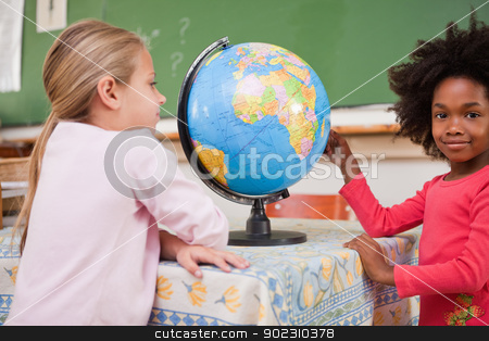 To use this stock image in your creative project, please select the size you need over to the right and click the "Add to Cart" button.
Your downloaded image will come with the Cutcaster watermark removed so don’t worry about the watermark you see on this page. Cute schoolgirls looking at a globe stock photo, Cute schoolgirls looking at a globe in a classroom by Wavebreak Media